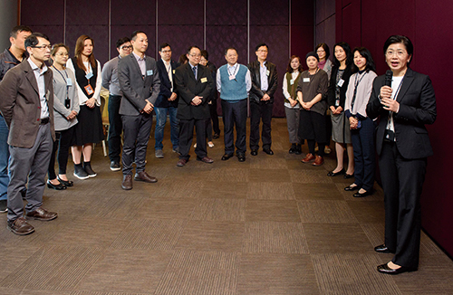 Deputy Commissioner (Management) Chiu Wai-yin (first right) meeting with civilian staff.